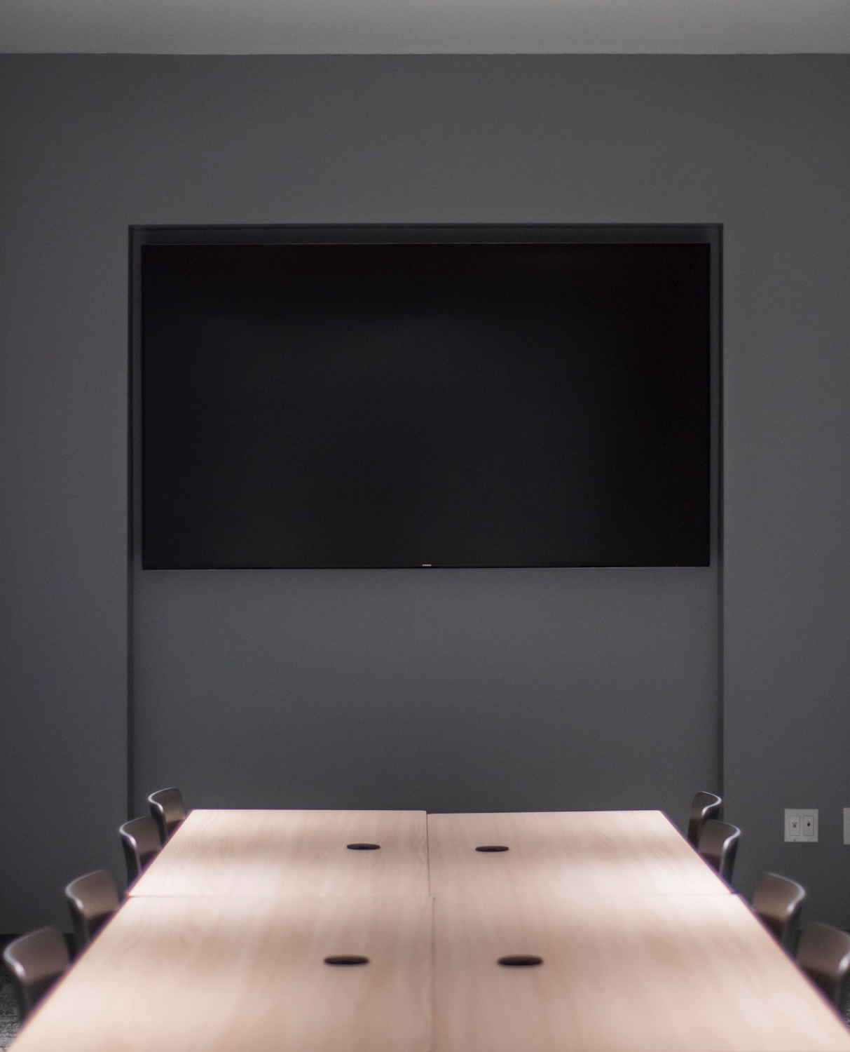 desk and wall screen in a boardroom